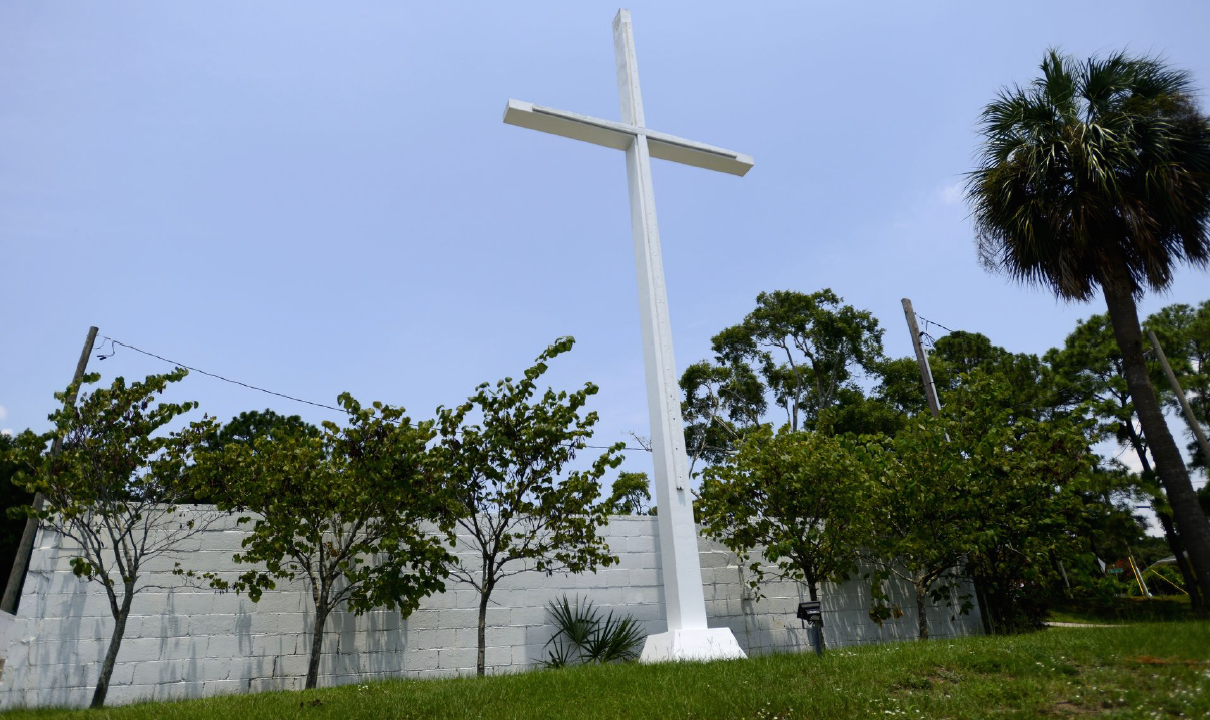 A large white cross in Bayview Park in Pensacola, FL