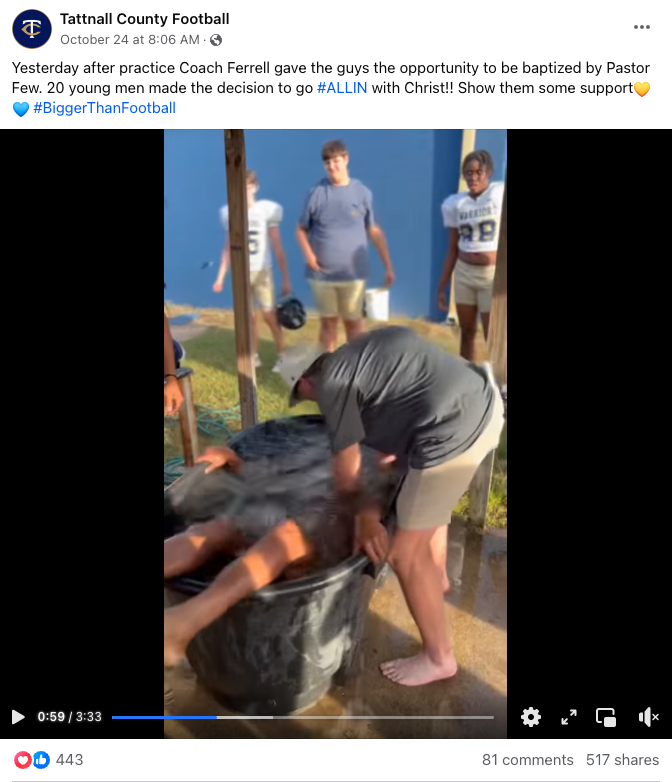 Screenshot of a social media post of high school football players getting baptized in a bucket on the field
