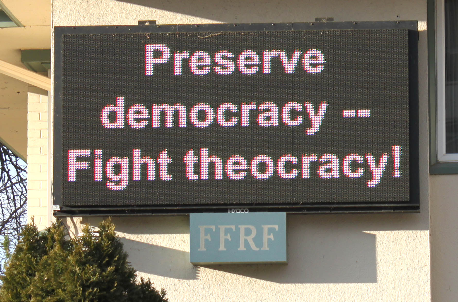 The electronic sign in front of the FFRF offices stating "Preserve democracy -- Fight theocracy!"