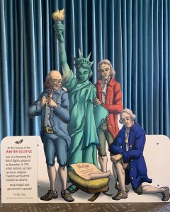 a photo of the ffrf bill of rights nativity. It features founding fathers and lady liberty looking down at a bill of rights